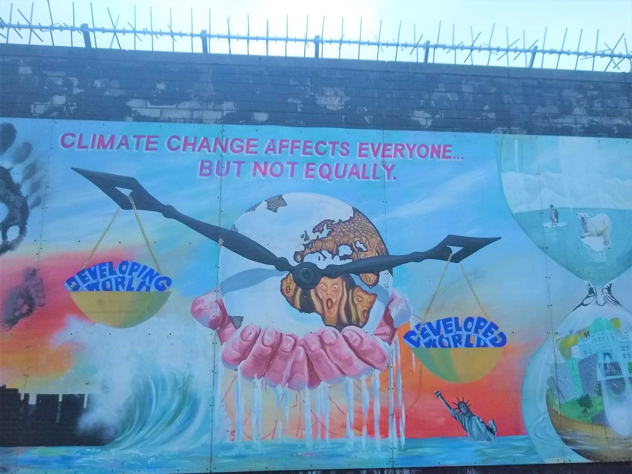 Climate justice mural on the International Wal, Falls Road, West Belfast